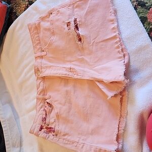 Pink distressed shorts